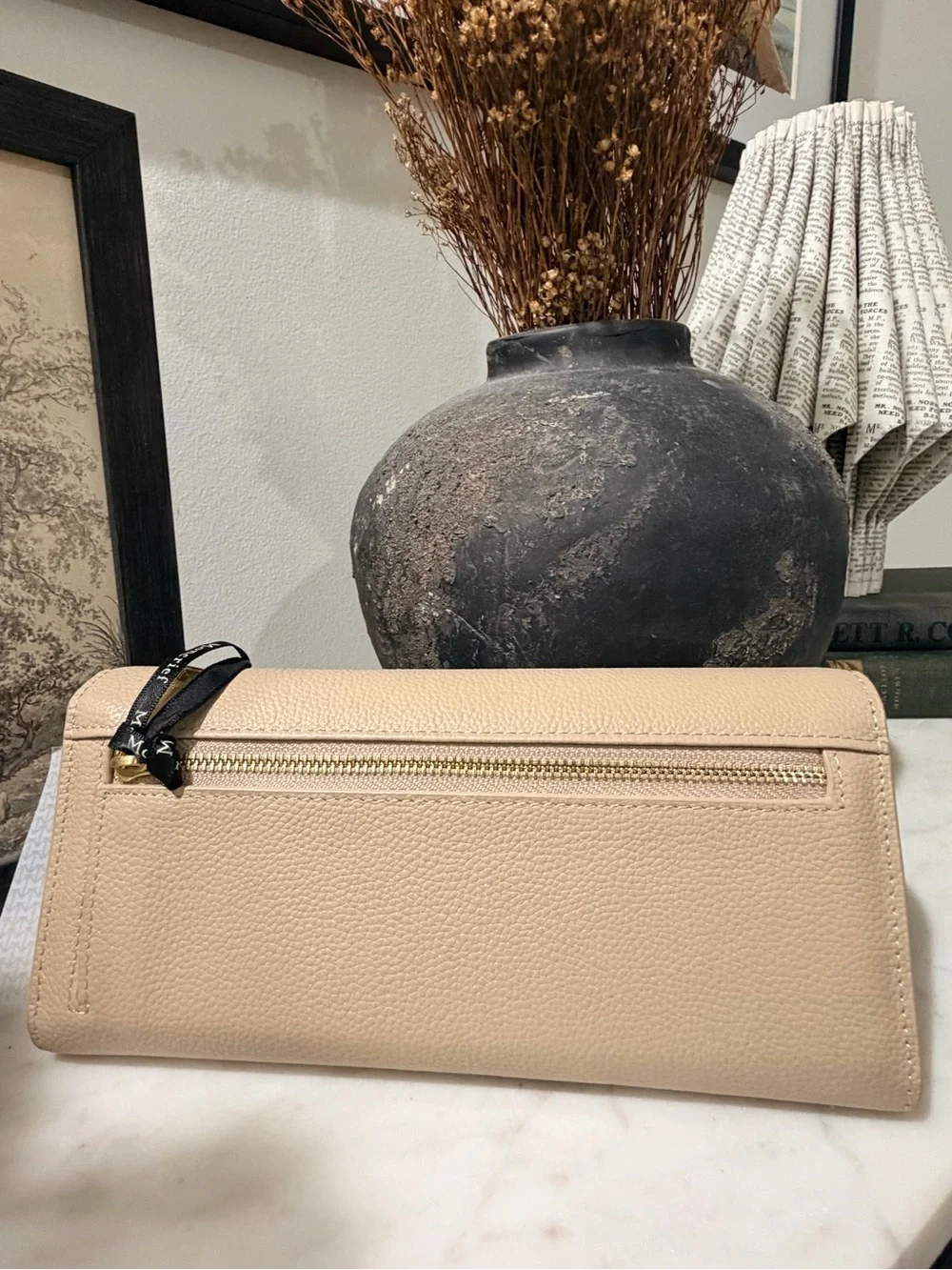Moncrieff Beige Pebbled Leather Clutch